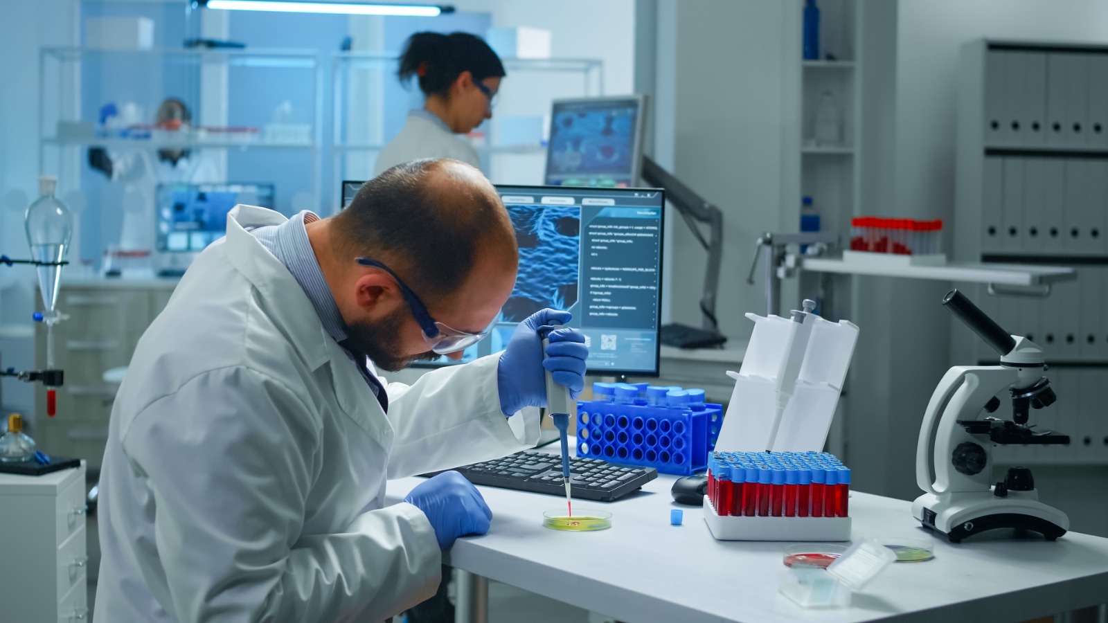 Analytical balance and pH meter on a bench in a pharmaceutical quality-control laboratory